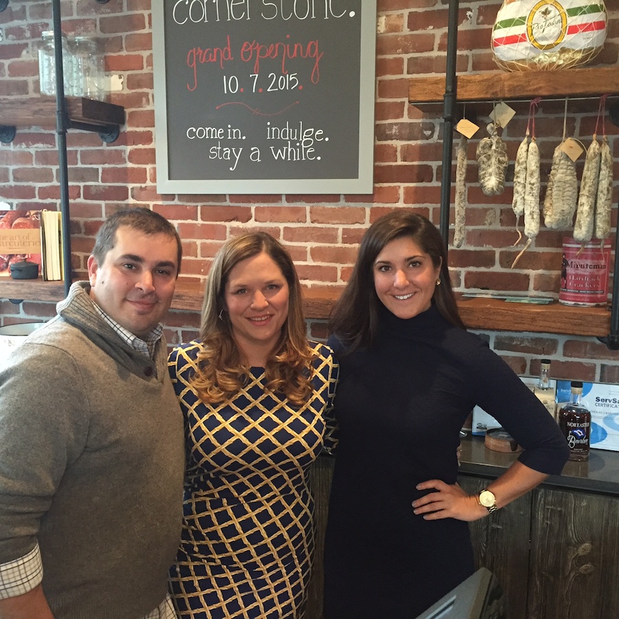 Cornerstone owner/chef Christine Doherty Kondra (center), her husband, Nick, and General Manager, Allison Luchy. Christine calls the interior design “industrial Northern California chic” with subway tiles, vintage brick wall, exposed wood beams and counter made from Kennett Square mushroom wood. 