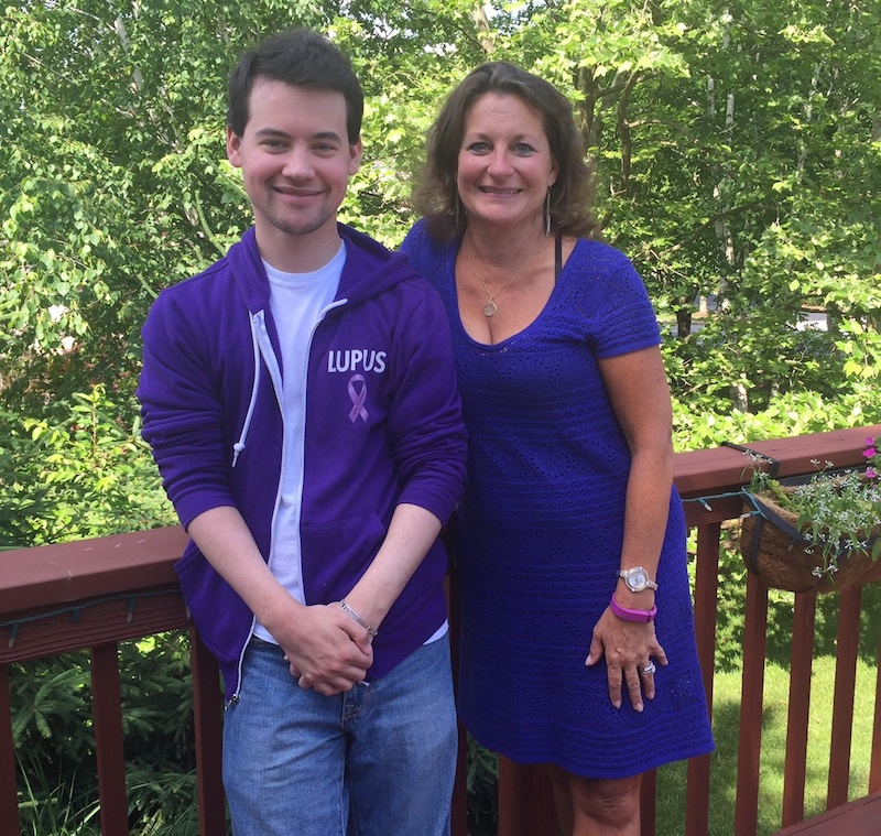 Scott and Betty Ann on their Berwyn deck wearing purple for lupus awareness. 