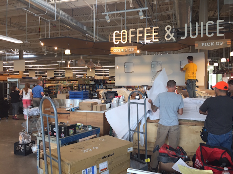 Workers prepare the Coffee & Juice Bar for Wednesday's opening. 