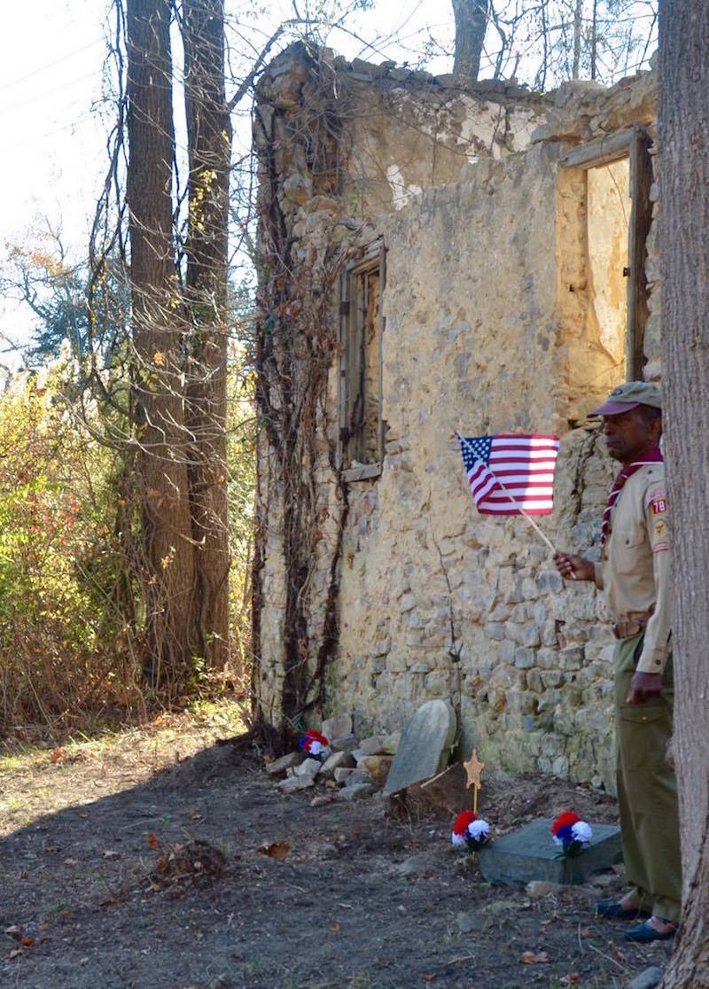 Al Terrell by the grave of Civil War soldier Joshua Johnson last November. Photo by Carla Zambelli. 