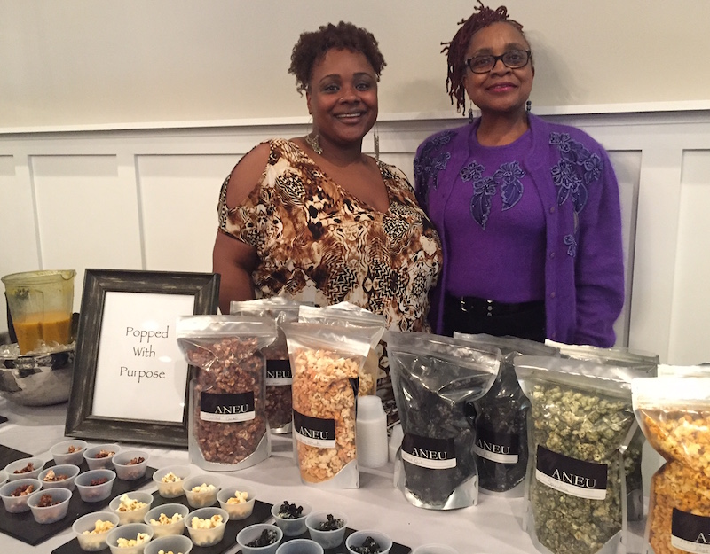 Exec. Chef Dorinda Hampton and her mother, Catherine, show off the house-made Popcorn with a Purpose.