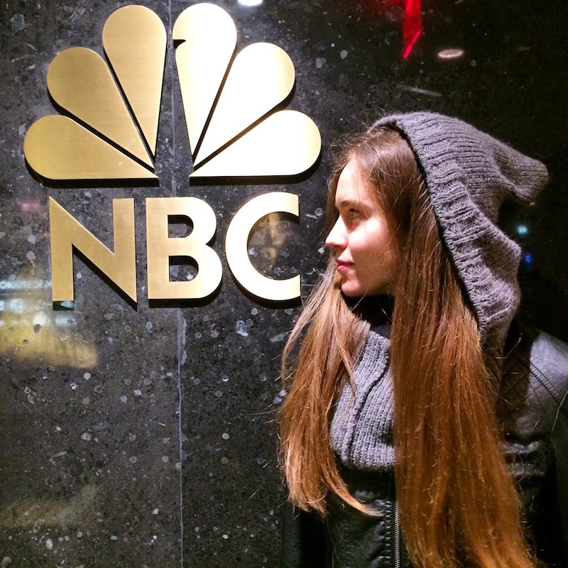 Avi Loren Fox models a mantle at NBC studios in NYC.