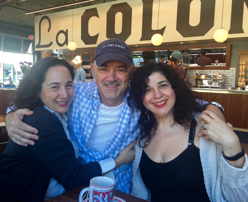 On opening morning, Todd hugs two of his longtime customers, twin sisters Mariann Boston Reh and Nickie Boston. The coffee mogul/wildnerness trekker/Travel Channel star was clearly stoked for his newest venture. 